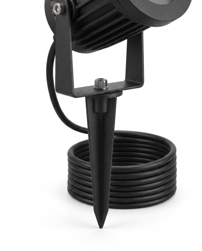 Delia spotlight ground spike and weatherproof cable detail — studio white
