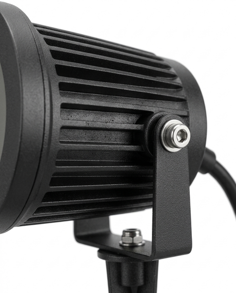 Delia spotlight finned heat-sink housing and tilt knuckle detail — studio white