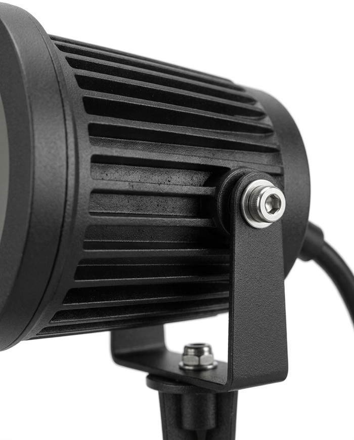 Delia spotlight finned heat-sink housing and tilt knuckle detail — studio white