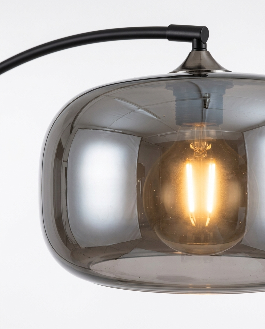 Dara arc floor lamp smoked-glass shade and warm bulb detail — studio white