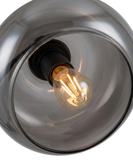 Dara arc lamp warm bulb and socket inside smoked-glass shade — studio white