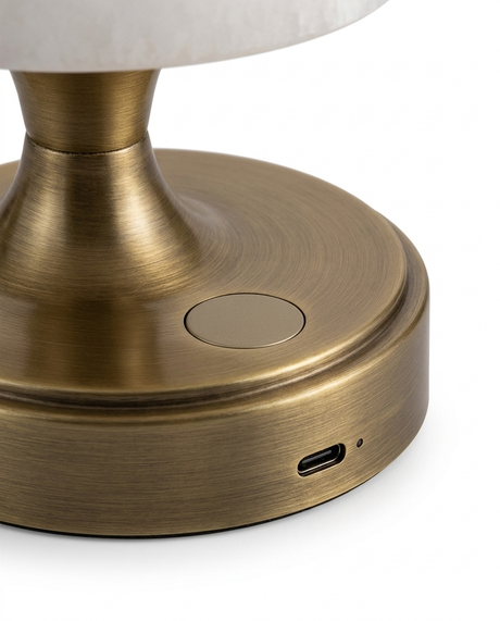 Close-up of the aged brass base with touch dimmer and USB-C charging port