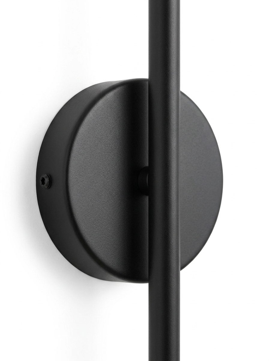 Close-up of the round matte-black wall-mount backplate