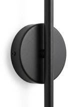 Close-up of the round matte-black wall-mount backplate