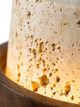 Macro of the natural travertine stone shade glowing warm from within