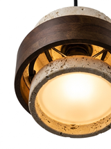 Close-up looking up into the warm glowing diffuser inside the stone shade