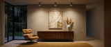 Joss concrete downlights casting warm pools in a mid-century modern living room lifestyle