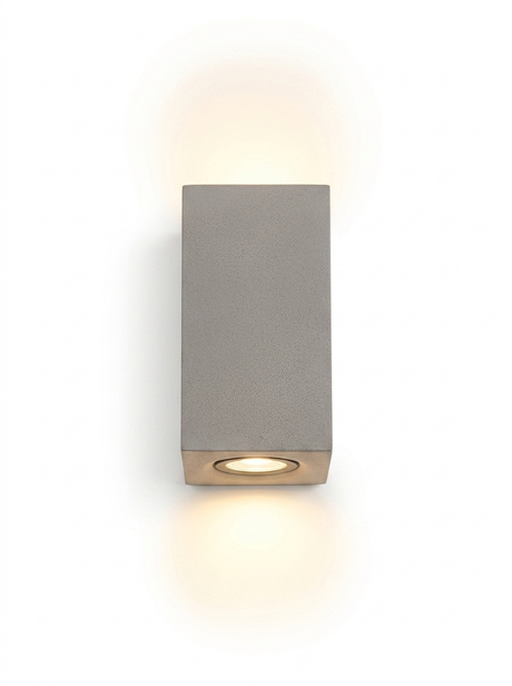 Ilse tall rectangular concrete up-down wall light in light concrete gray on a studio white background