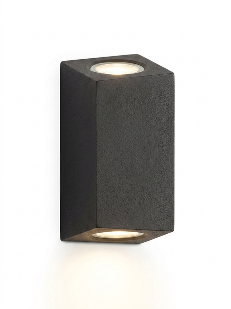 Ilse tall rectangular concrete up-down wall light in gray-black on a studio white background