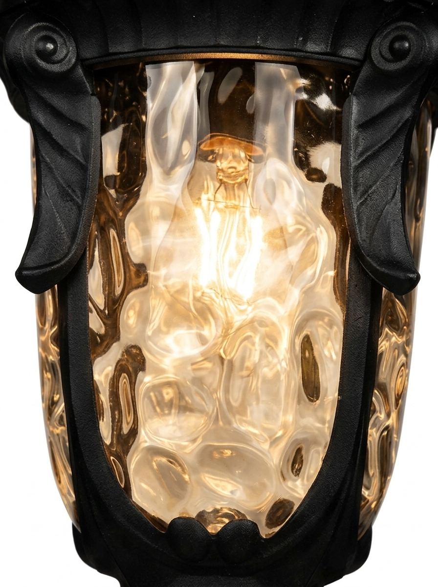 Close-up of the rippled water-glass panel with the warm bulb glowing
