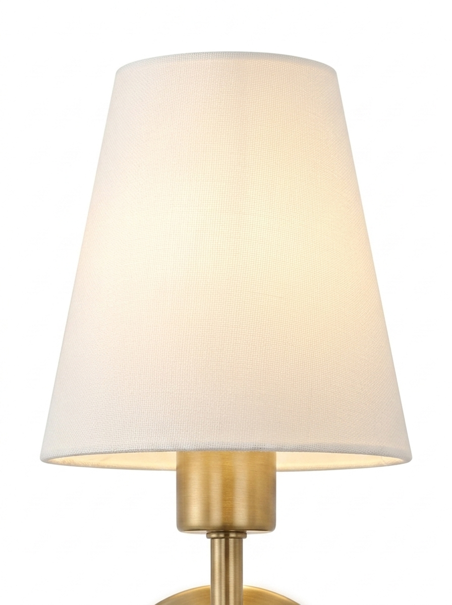 Close-up of the white empire fabric shade glowing warm