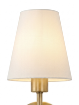 Close-up of the white empire fabric shade glowing warm