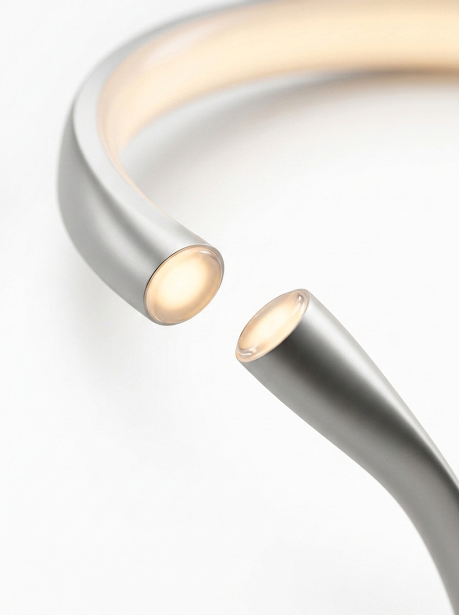 Close-up of the two tapered open tips of the C-shaped ring