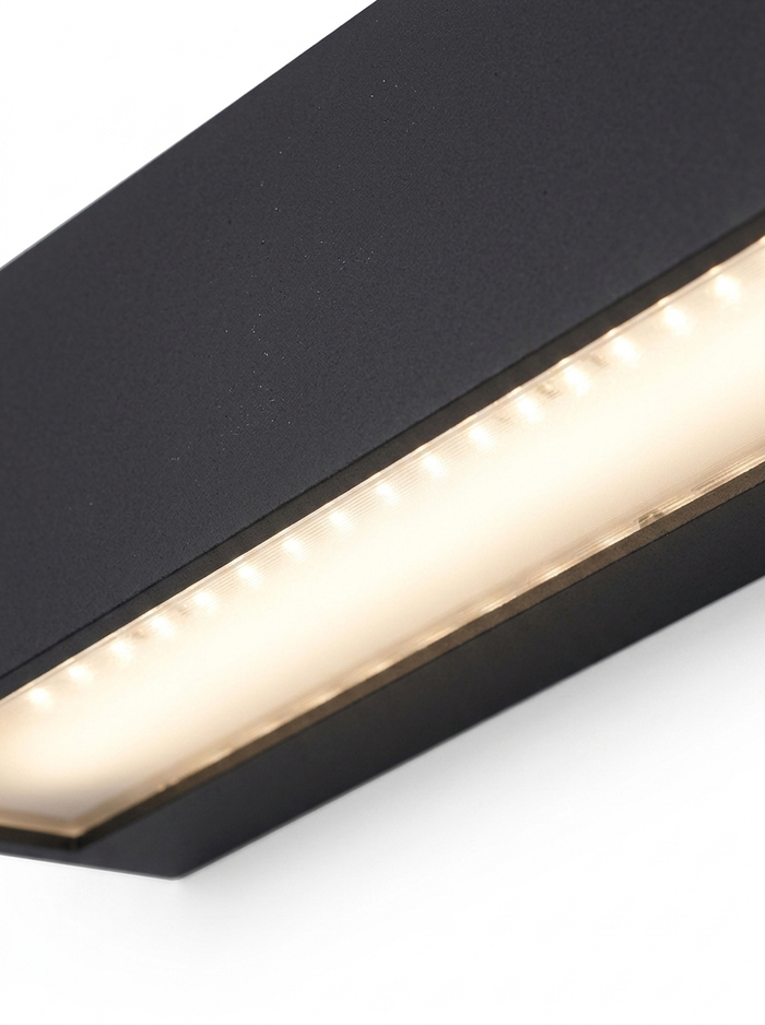 Close-up of the acrylic diffuser glowing warm along the length