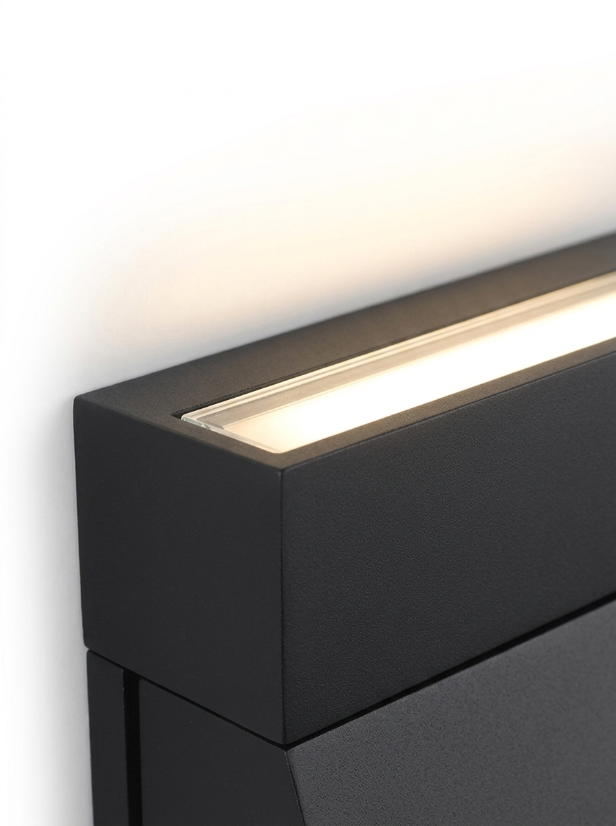 Close-up of the top edge emitting a warm up-wash of light