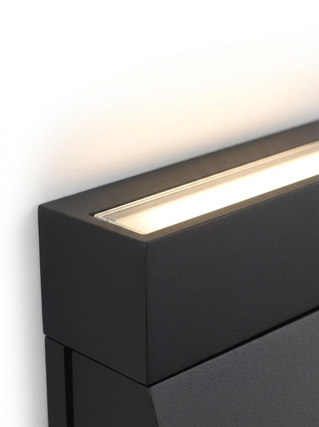Close-up of the top edge emitting a warm up-wash of light