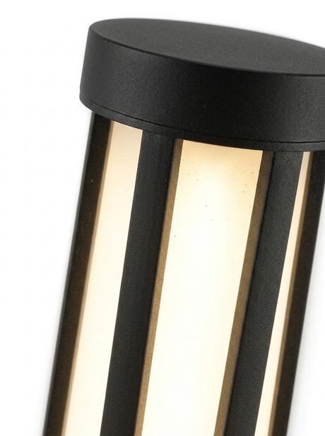 Three-quarter close-up of the glowing top section and cap