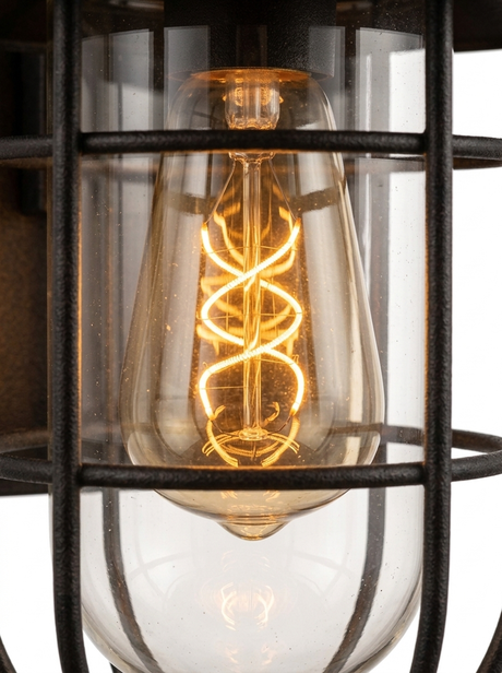 Close-up of the warm Edison filament bulb glowing inside the glass