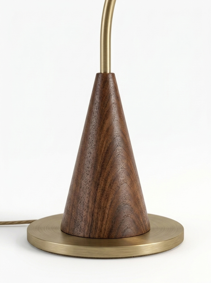 Cyra walnut cone base and brass foot close-up