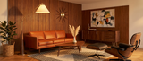 Cyra brass arc floor lamp styled in a mid-century modern living room — lifestyle