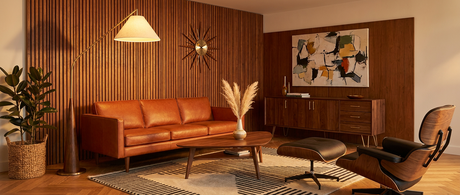 Cyra brass arc floor lamp styled in a mid-century modern living room — lifestyle