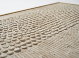 Dovre raised pebble-dot rows in raking light close-up