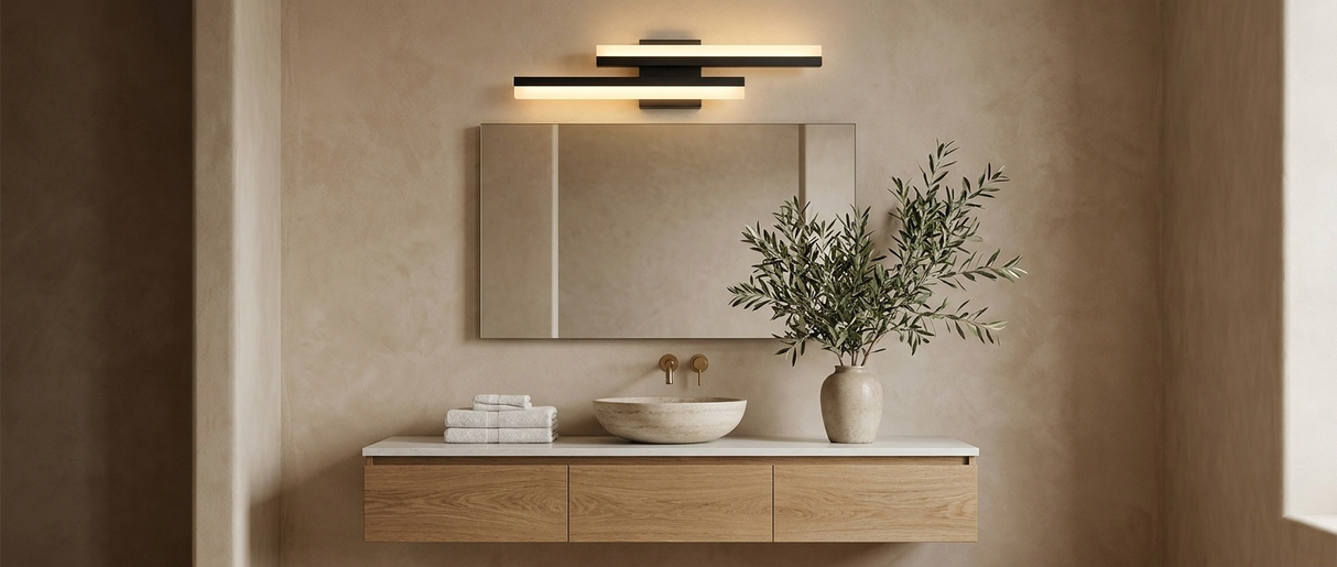 Orla asymmetric vanity light over a mirror in a warm modern bathroom — lifestyle
