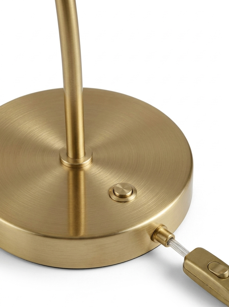 Elio round brushed-brass base and inline switch close-up