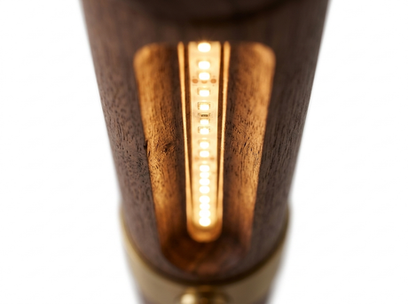 Ivo warm linear LED glowing under the walnut bar close-up