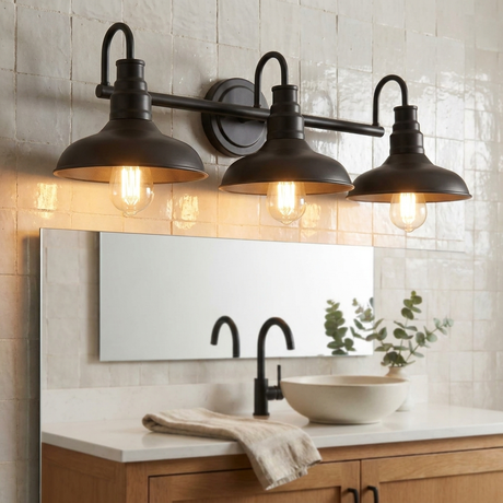 Doria matte-black gooseneck vanity light glowing over a farmhouse bathroom mirror