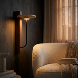 Vero sconce in a cozy reading nook at dusk