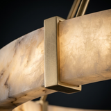 Aura alabaster and champagne-brass bracket detail