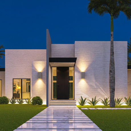 Ilse concrete up-down wall lights, pair on a modern white home at dusk