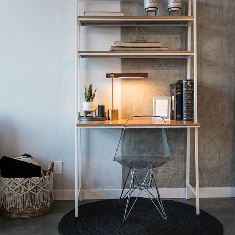 Ivo walnut-and-brass desk lamp on a concrete-and-steel industrial ladder desk