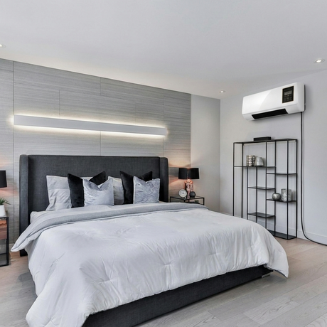 Vento AC mounted in a minimalist grey bedroom