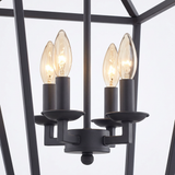 Kerri matte black cage pendant — four candelabra cluster detail on white