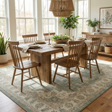 Wrenna sage medallion rug under a farmhouse dining table — lifestyle