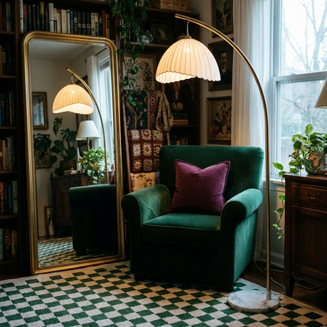 Arcadia arc floor lamp over an emerald velvet armchair with brass mirror and green checkerboard rug