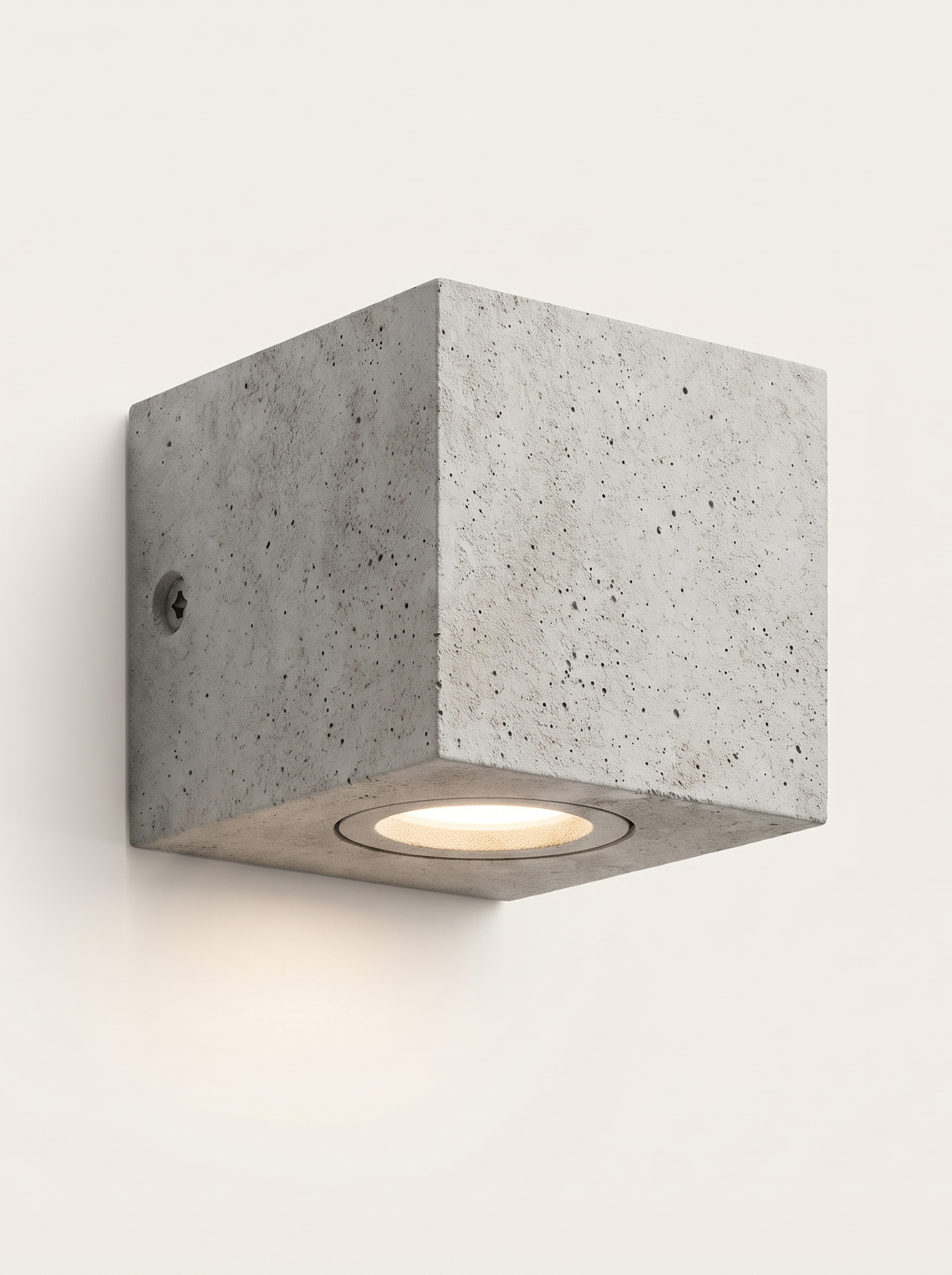 Ilse concrete outdoor wall light lit warm on a soft off-white studio background