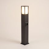Cairn bollard path light lit warm on a soft off-white studio background