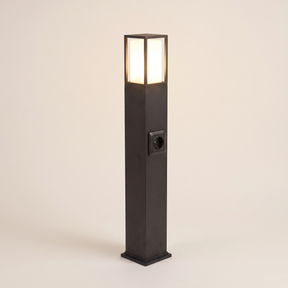 Cairn bollard path light lit warm on a soft off-white studio background