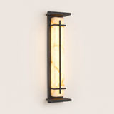 Luminara marble-panel outdoor wall sconce lit warm on a soft off-white studio background