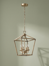 Kiel 4-light lantern pendant in soft gold on a sage backdrop