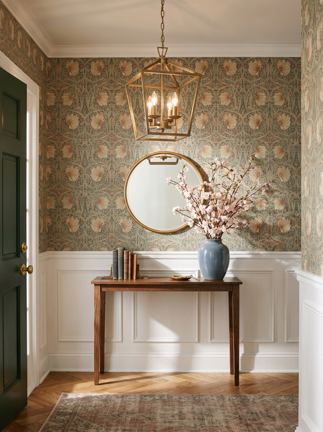 Lifestyle: soft gold Kiel lantern pendant in an entry hall with floral wallpaper, shown to scale above a walnut console