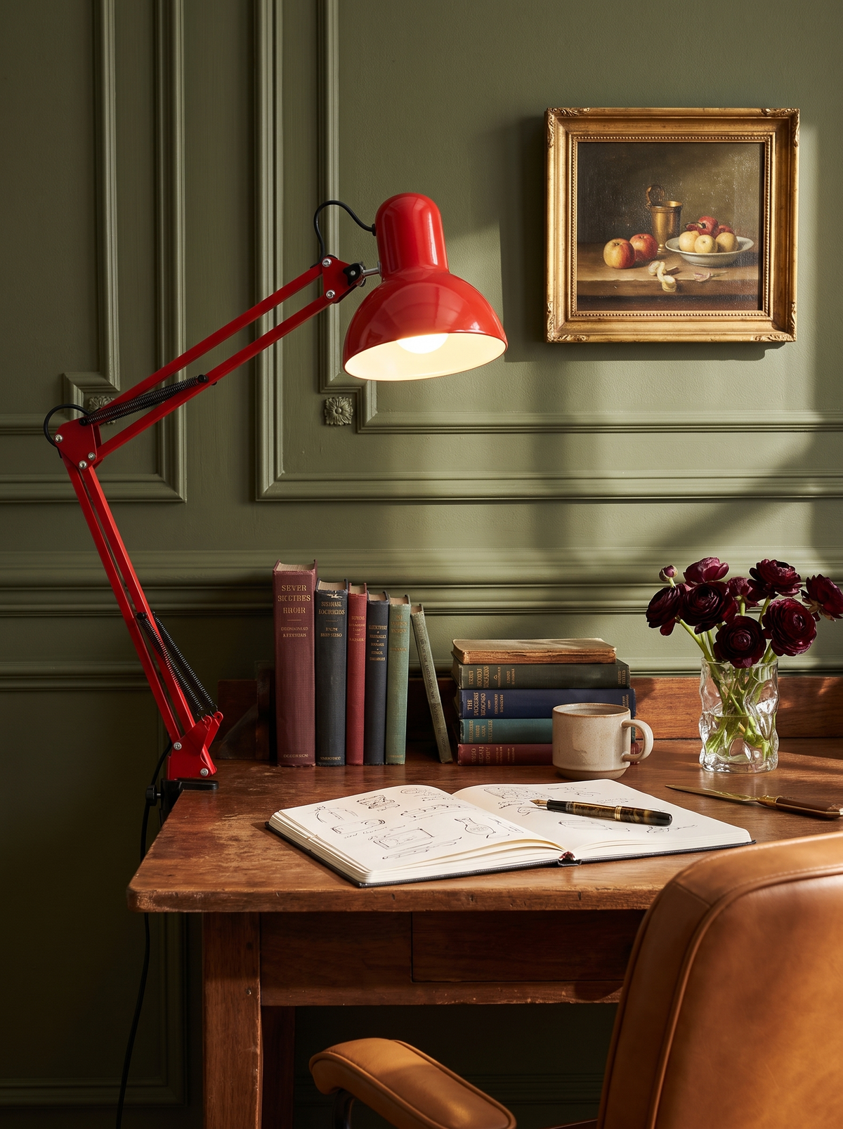 Lifestyle: Otis architect clamp lamp in red on an antique writing desk against green panelling