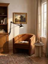 Lifestyle: Otis architect clamp lamp in black over a reading chair