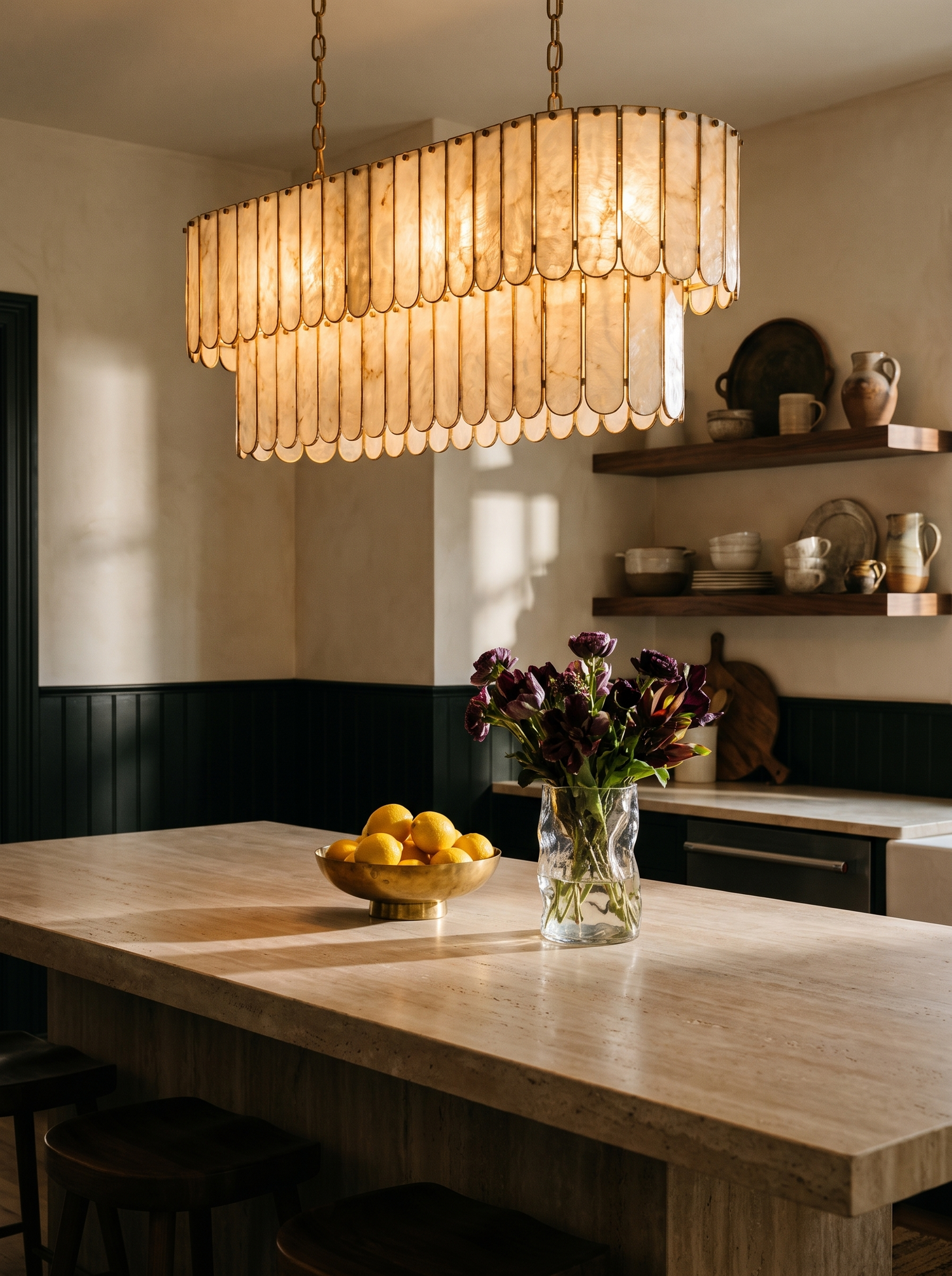 Lifestyle: Marelle oval shell chandelier over a travertine kitchen island