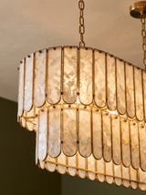 Lifestyle: close-up of Marelle's pearl-shell slats and brass frame, lit