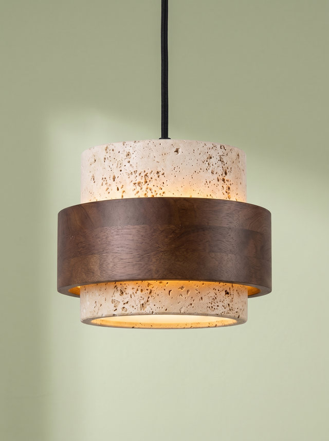 Rune travertine and walnut pendant light glowing on a pistachio green backdrop