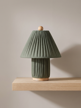 Esme table lamp in dark green on a greige backdrop